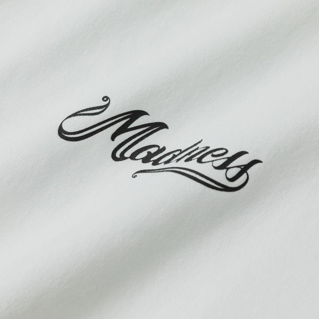 MADNESS BADGE(L) UNIFORM T-SHIRT